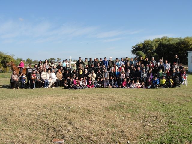 The family gathered on the reclaimed land